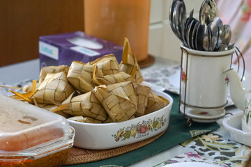 A beautifully arranged table showcasing traditional ketupat and other dishes during Eid Mubarak (Hari Raya) celebrations in Malaysia.
