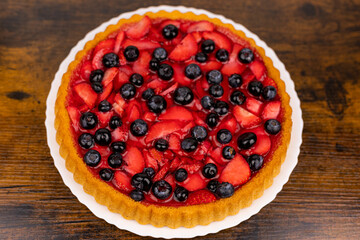 Fresh berry pie on a plate close-up. Berry pie close-up. Homemade cakes