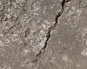 Background of destroyed concrete path, gray concrete, concrete texture, close-up. Natural photo. Old concrete slab