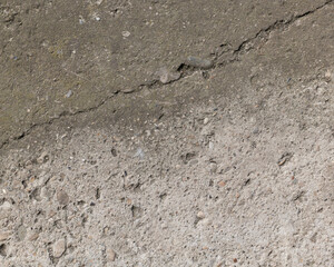 Background of destroyed concrete path, gray concrete, concrete texture, close-up. Natural photo. Old concrete slab