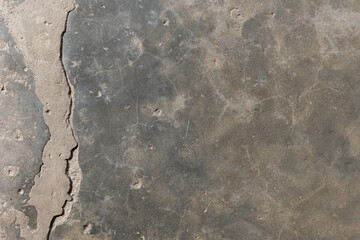 Background of destroyed concrete path, gray concrete, concrete texture, close-up. Natural photo. Old concrete slab