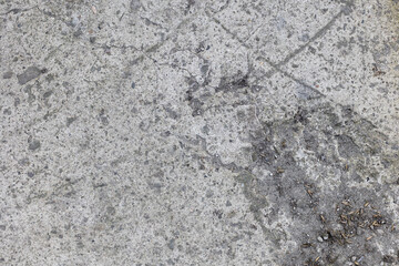 Background of destroyed concrete path, gray concrete, concrete texture, close-up. Natural photo. Old concrete slab