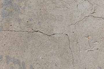 Background of destroyed concrete path, gray concrete, concrete texture, close-up. Natural photo. Old concrete slab