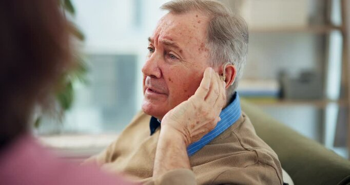 Nurse, senior man and hearing aid on ear for medical support, wellness and innovation. Person with a disability, healthcare worker and deaf patient with audiology implant, service and sound waves