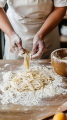 Fototapeta premium Hands making homemade pasta in a rustic kitchen setting