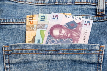 Sierra Leonean leone in the pocket of blue jeans