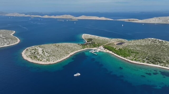 Turquoise Sea Surrounding Islands In Kornati Archipelago Of Croatia. aerial pullback shot