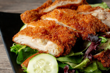 A closeup view of a chicken katsu salad.