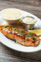 A view of a grilled salmon entree.