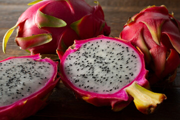 A closeup view of a halved red dragon fruit.