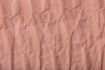 Abstract wrinkled muted mauve crumpled paper texture background