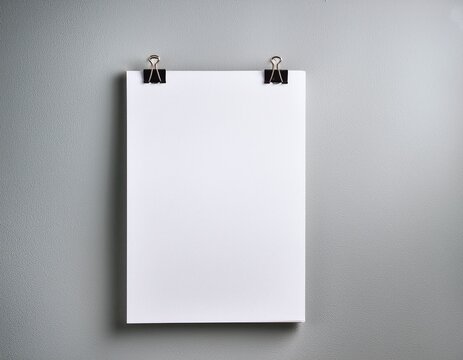 Blank white poster mock-up with metal clips on a light gray wall. Empty canvas sheet template for design, photo, or picture. Modern minimalist interior with copy space. - Powered by Adobe