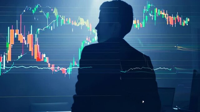Silhouette of businessman viewing stock market charts and graphs. Trading data with candlestick patterns continually updating on large digital screen as figure observes fluctuations.