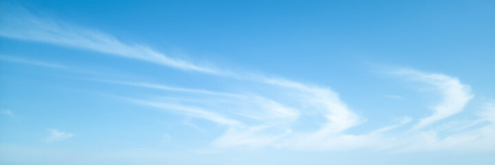 Obraz premium Cloudscape, Beautiful blue sky with wispy, feather-like cirrus clouds stretching across the horizon, for a background