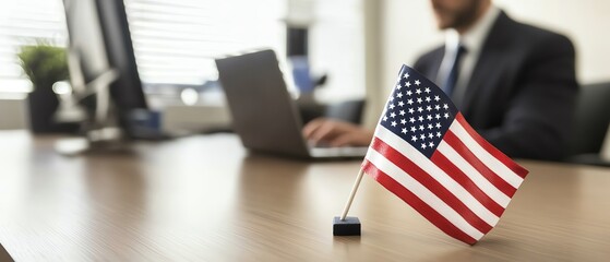 American flag on desk in office environment.
