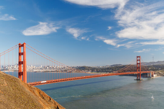 Iconic view of the Golden Gate Bridge bathed in warm sunlight - Powered by Adobe