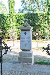 Fototapeta premium military cemetery. A place of remembrance for those who died in World War I in the courtyard of an ancient Basilica di Santa Maria Assunta, Aquileia, Italy