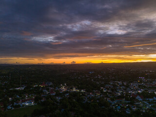 An aerial view of Waingapu City at night, with the glow of household lights visible across the town