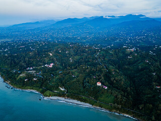 Aerial view of The Batumi Botanical Garden is on the Black Sea cost. Chakvi beach. Adjara. Georgia. Green city by the sea and mountains