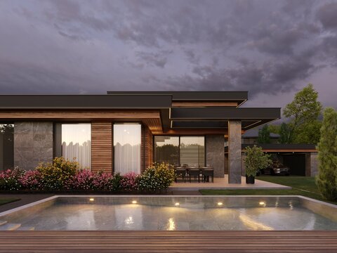 Modern house with flat roof and panoramic windows. Exterior. Evening illumination of the facade. House with swimming pool and large terrace. Modern architecture