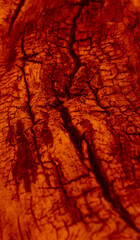 Cracks in a hot solidifying lava flow closeup view. Pattern of hot lava stock image. Free royalty  lava vertical background