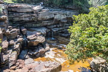 An impressive building atop a lovely hill, surrounded by trees, Bokor National Park
