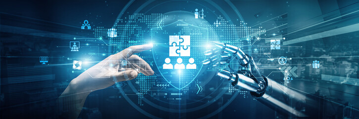 Hands of robot and human touch on Teamwork signify collaboration in achieving shared goals....