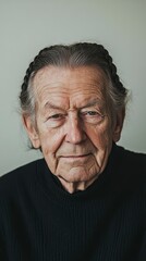 Obraz premium Portrait of a Senior Man with Braided Hair