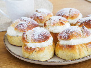 Homemade Semla or semlor, vastlakukkel, laskiaispulla - traditional Scandinavian and Baltic countries sweet bun