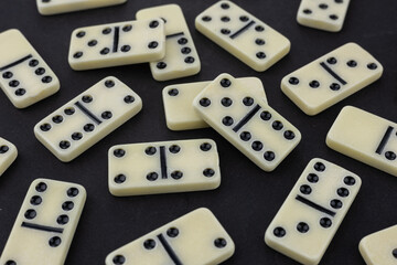 Domino tiles on dark background studio shot