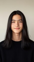 Fototapeta premium Portrait of a Young Man with Long Black Hair