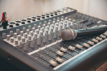 Production sound engineer woman hands adjusting volume equalizer voice, mixing console. DJ sound...