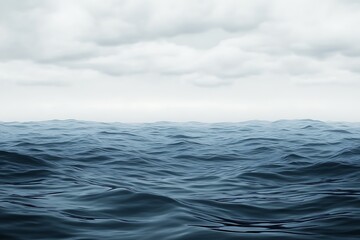 Serene body of water surrounded by nature reflecting the beauty of the clear blue sky above