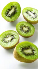 Fototapeta premium Sliced kiwi reveals vibrant green flesh and tiny black seeds against a clean white backdrop. A burst of natural color and texture