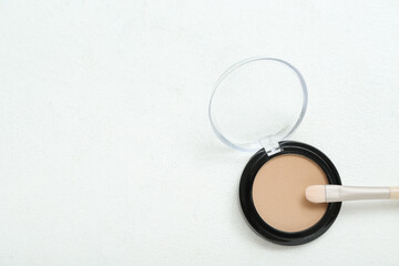 Mono eyeshadow with brush on white background