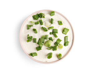 Bowl of tasty sour cream with green onion on white background