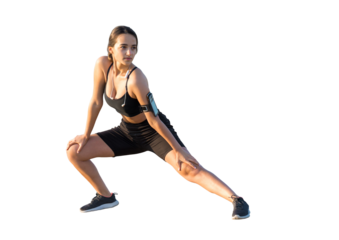 A sporty slim girl in leggings and a top is standing with a training mat, resting between exercises.