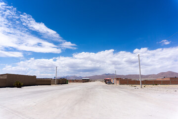 Dusty Unpaved Streets of Uyuni Bolivia with Houses Under a Clear Blue Sky in a Remote Andean Town Near the Famous Salt Flats