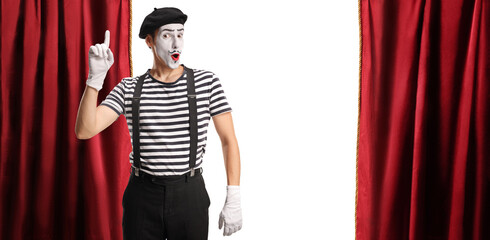 Mime pointing up on stage