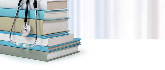 Medical literature concept. Books and stethoscope. Medical students studying.