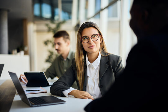 Professional Business Meeting in a Modern Office Environment with Natural Light