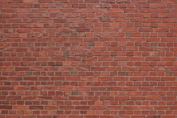 Closeup of old red brick wall background.
