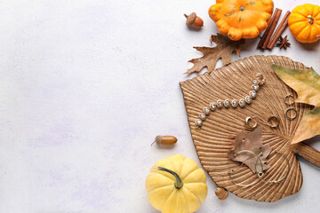 Composition with different female accessories and autumn decor on light background