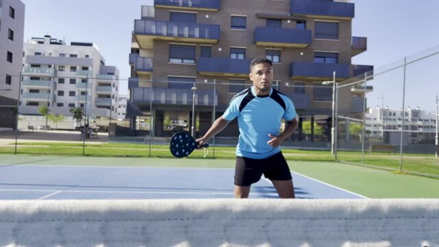 Athlete practicing pickleball serves on court