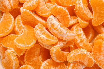 Texture of sweet peeled mandarins as background