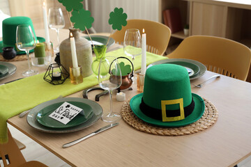Festive table serving with leprechaun's hat and decorations for St. Patrick's Day celebration