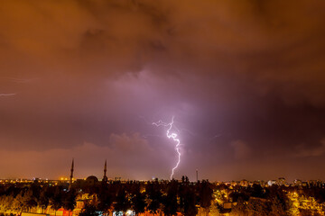 Lightning discharges in the night sky during a thunderstorm. Large thundercloud and lightning...