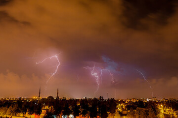 Lightning discharges in the night sky during a thunderstorm. Large thundercloud and lightning...