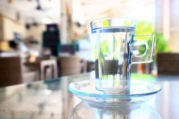 a glass of cold water on the table in the restaurant