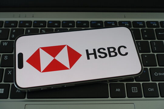 Kiel, SH, Germany, 04-01-2025 HSBC logo displayed on a smartphone resting on a laptop keyboard, showcasing modern banking technology and connectivity
